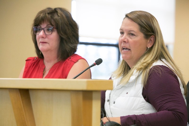 Mountain View Regional Waste Management Commission chair Mary Anne Overwater, left, and Mountain View County councillor Patricia McKean speak with county councillors at the