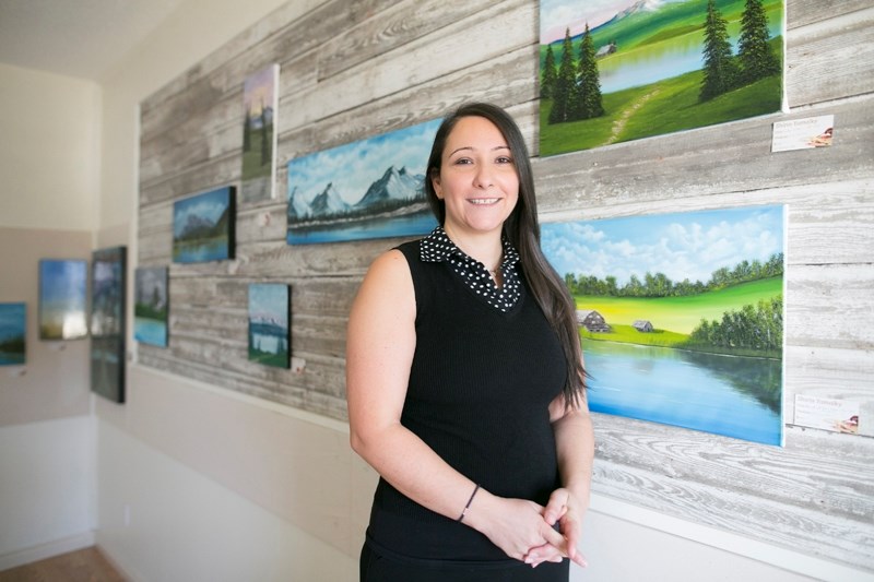 Shirin Yamolky with some of her artwork at the Carstairs Heritage Centre on Nov. 24.