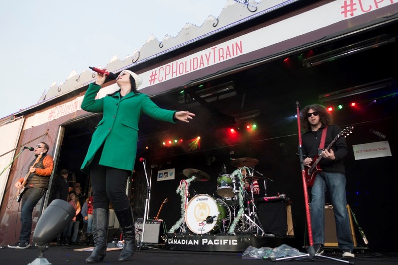 Emma-Lee, centre, and fellow musicians perform during the Canadian Pacific Holiday Train&#8217;s stop in Didsbury on Dec. 7. Large crowds also turned out for performances in