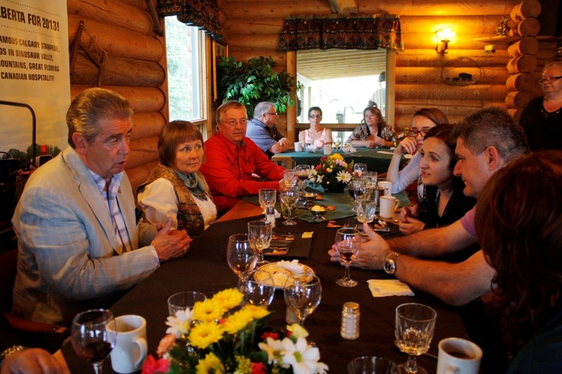 Olds College officials and Bosnian agriculture specialists talk at Diamond Buffalo