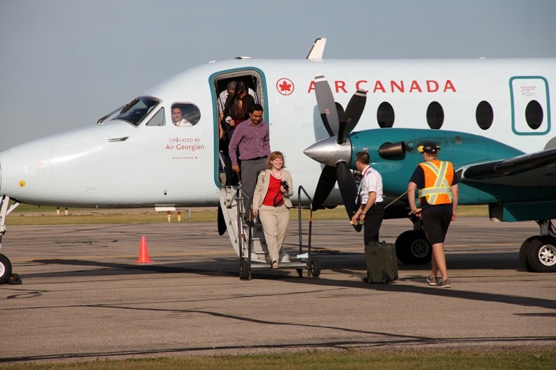 Passengers arrive at Red Deer airport