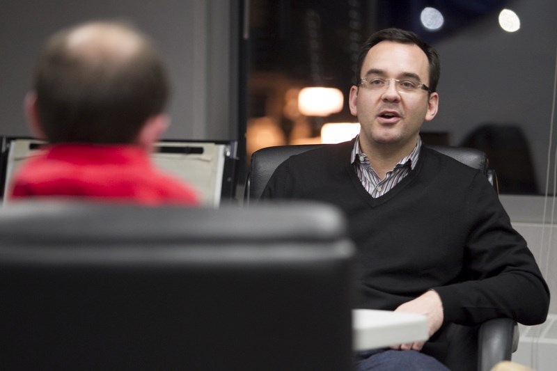 Blake Richards speaks with a guest.