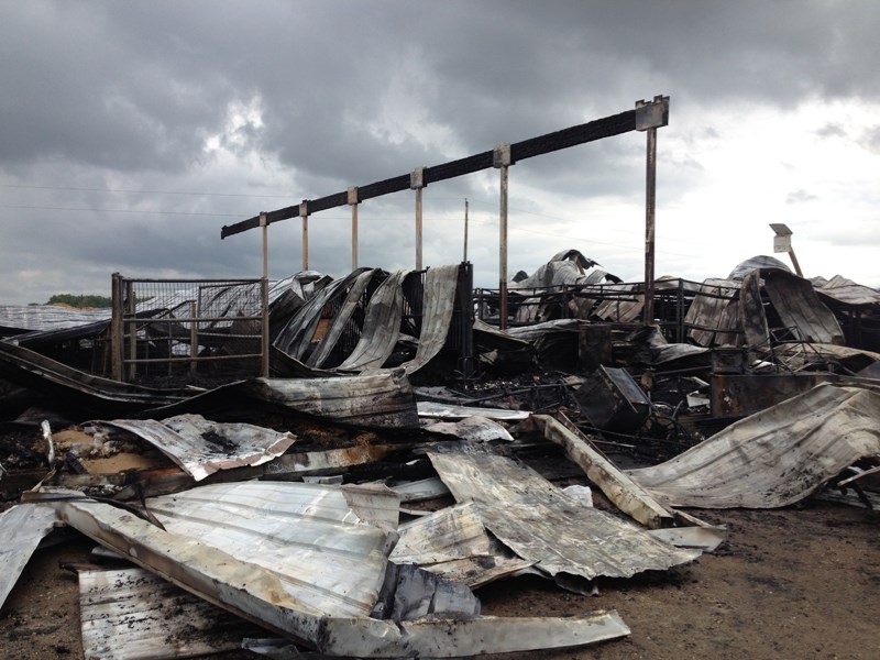 The remains of a barn southeast of Didsbury following a fire.