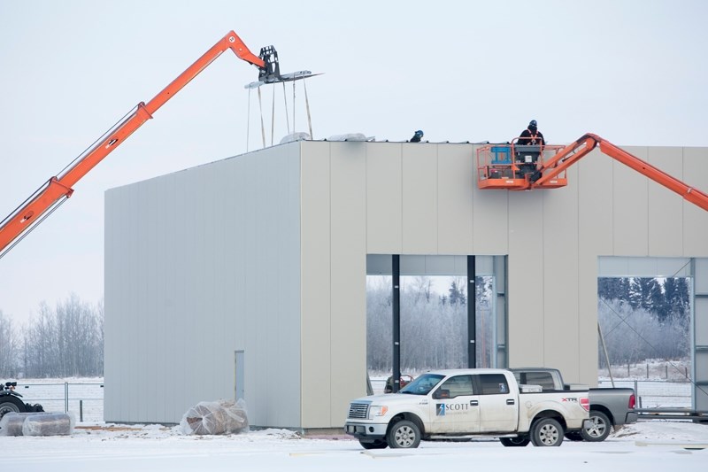 A construction crew works on the new Mountain View County ag shop next to the county office on Jan. 6.