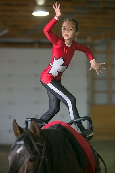 Jaydee Fluet, 9, a member of the Diamond Willow Vaulting Club, practises her routine in preparation for an upcoming competition in B.C. See more on page 3.