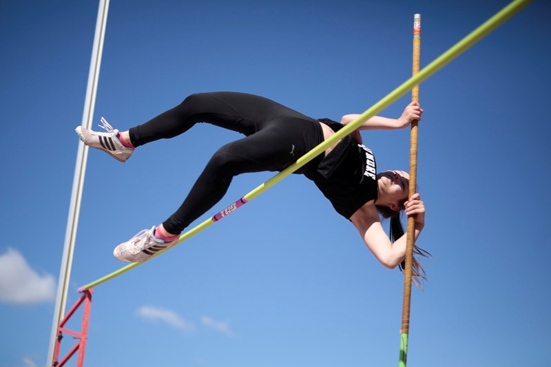 Sundre High School student Kate Jackson competes in the pole vault event at the South Central Zone High School Championships at Foothills Athletic Park in Calgary on May 24.
