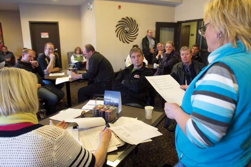 Debra Stoski, right, speaks to Innisfail business owners about the possibility of creating a downtown association at a meeting at the Best Western on Thursday, March 31.