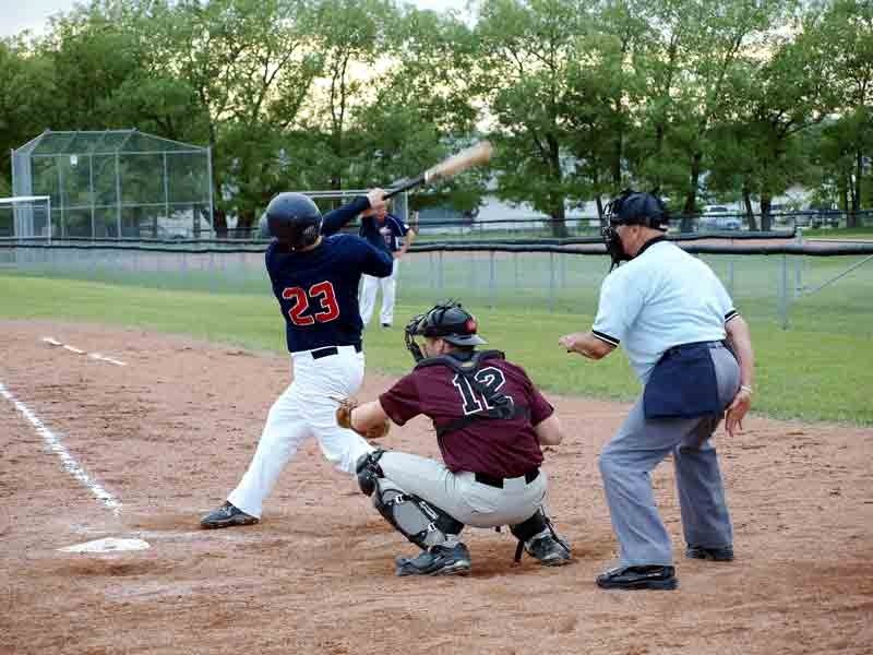 Innisfail Indians&#8217; Blaine Hoppins takes a big swing at the plate during the team&#8217;s June 29 game against the Red Deer Goliath Razorbacks. Red Deer won the game 8