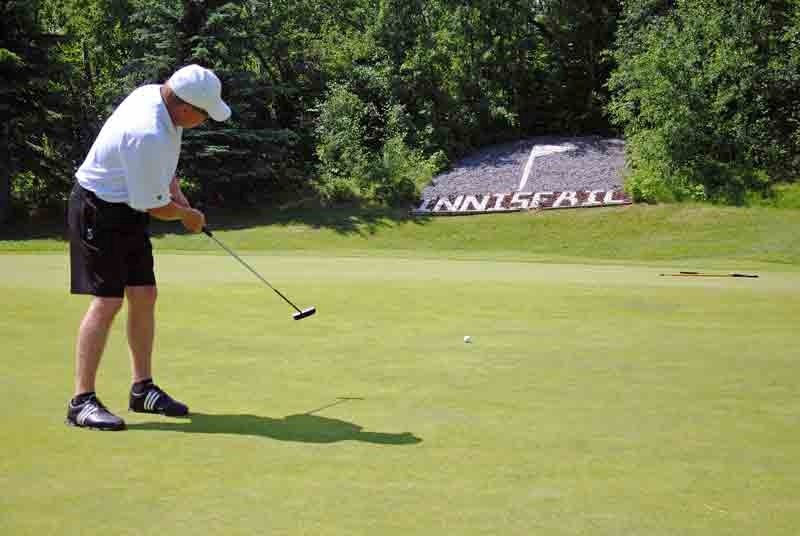 Doug Blatz tries to sink a long putt on Aspen #9 during the 25th Innisfail Rotary Golf Tournament on July 7.