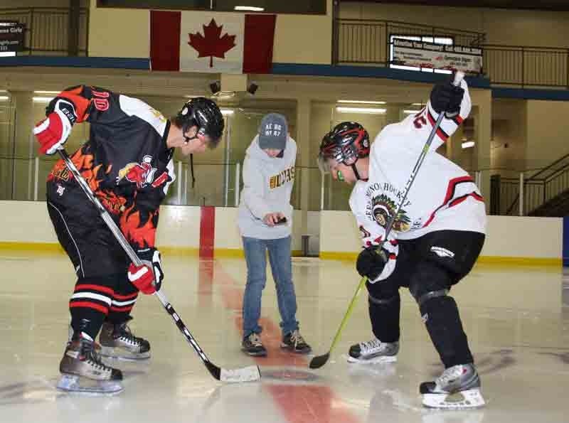 Stephen Radu, drops the puck before the start of a game Saturday afternoon at the Penhold Multiplex. The 24-hour hockey game was hosted in support of Kids Cancer Foundation