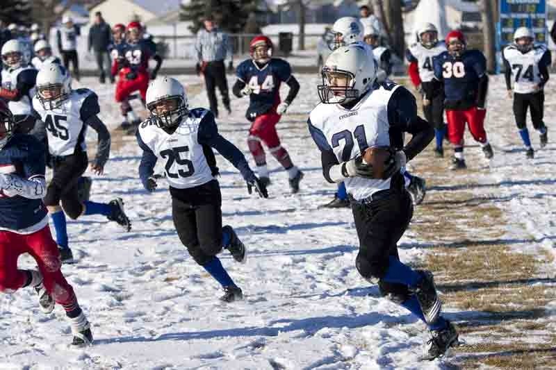 Innisfail Cyclones player Jeremy Klessens rushes down the field during the cyclones game against the Strathmore Spartans last Saturday.