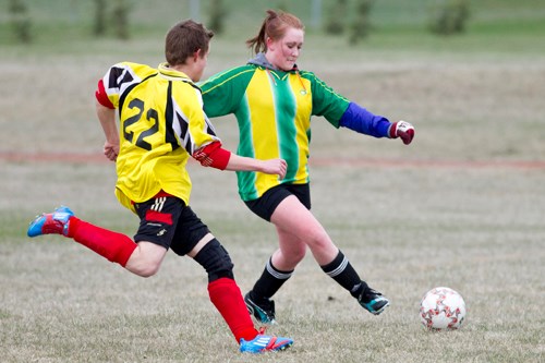 Bowden U18 player Kathleen Teuling chases after the ball during Bowden&#8217;s game against Didsbury at the Bowden Grandview School last Thursday. Didsbury won the game 5-0.