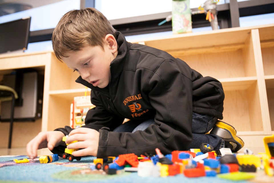 Riley Dowler plays with LEGO at the Innisfail Public Library during a LEGO Builders Unite! program Oct. 18.