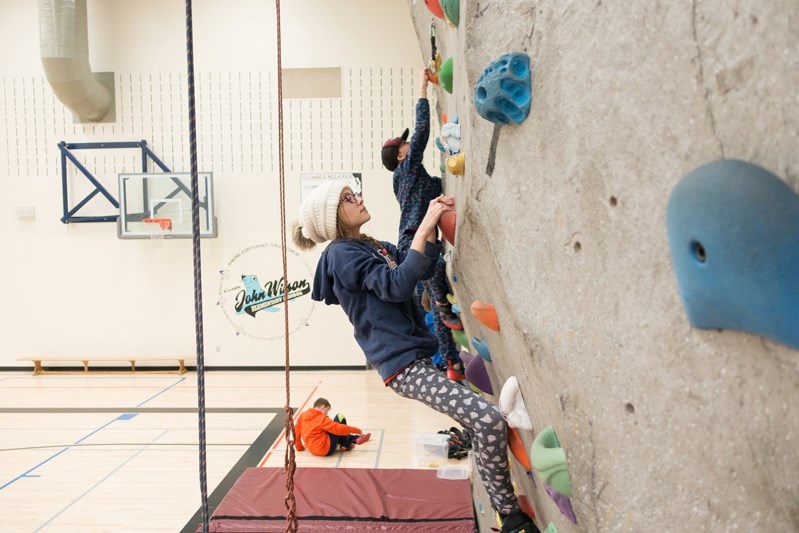 Kallie Fay boulders during a climbing session hosted by the Town of Innisfail at Innisfail Schools Campus on Jan. 30.