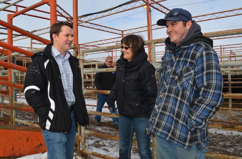 Devin Dreeshen (left) was out campaigning at the Innisfail Auction Market on Feb. 14, just one day after announcing he was seeking the vacant MLA seat for the Innisfail