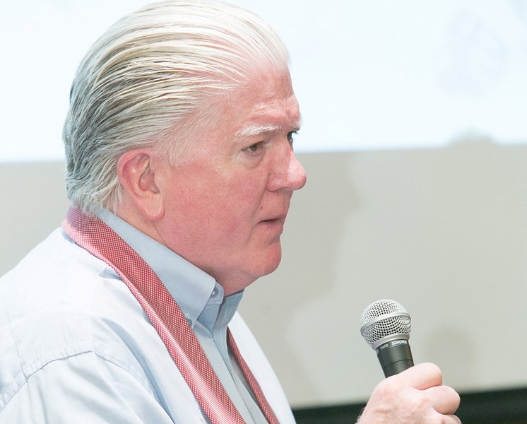Calgary Flames president of hockey operations Brian Burke answers a question during a hot stove sessionin Olds earlier this month.