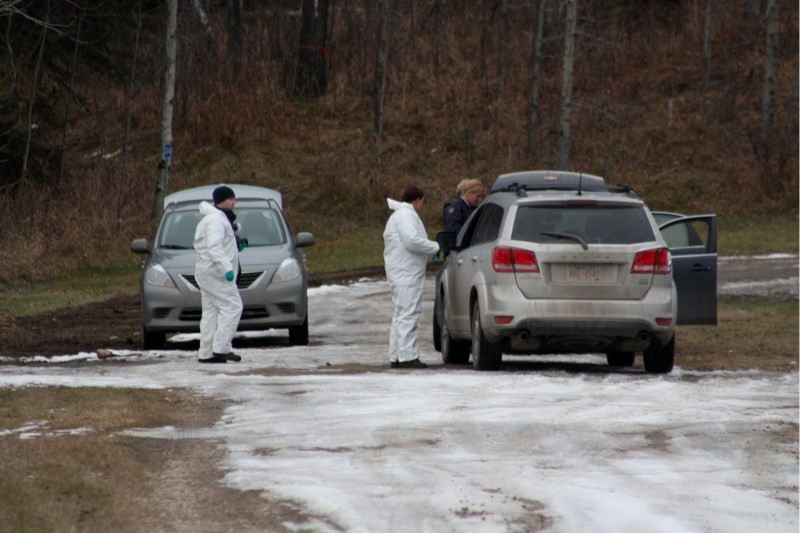 Forensics specialists and RCMP officers could be spotted near the Red Lodge Estates crime scene Nov. 6.