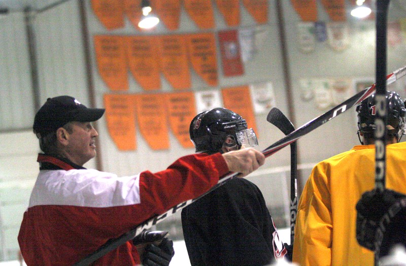 Brian Sutter runs his hockey players through practice drills