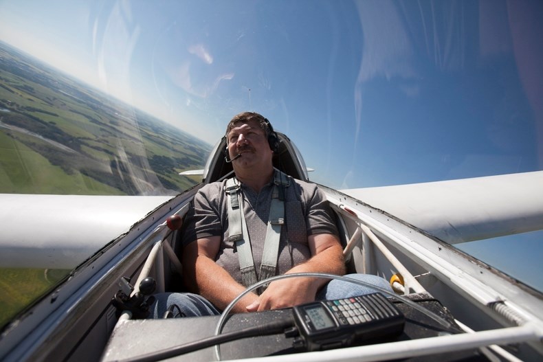 Pilot Leo Deschamps makes a turn while taking a glider for a turn around the Innisfail Airport.