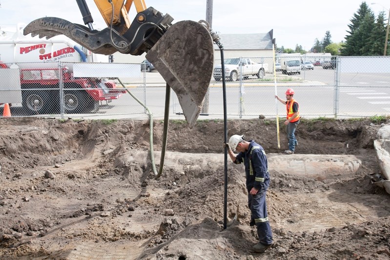 Work crews dig out the old gas tanks last week at Innisfail 2020 Auto Service.