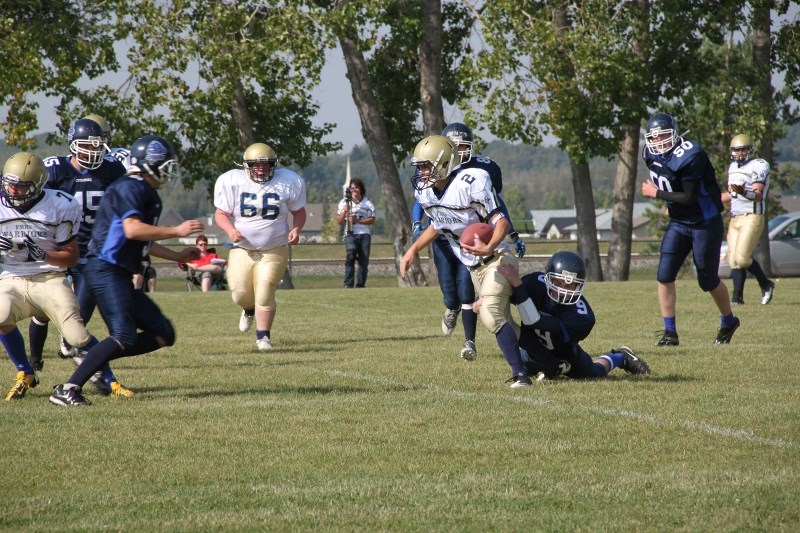 The Innisfail Cyclones, blue, in action last weekend against the Warriors white.