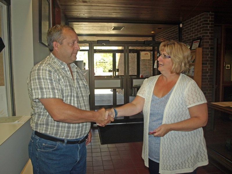 Brian Spiller is acclaimed mayor yesterday by returning officer Heather Whymark, the town&#8217;s director of corporate services. Spiller was the only candidate to file