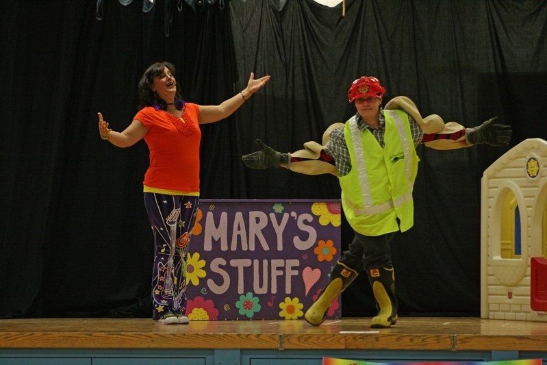 Mary Lambert, left, and Grade 2 teacher Ashley Sampson performed a song about fire safety for students on Oct. 15.