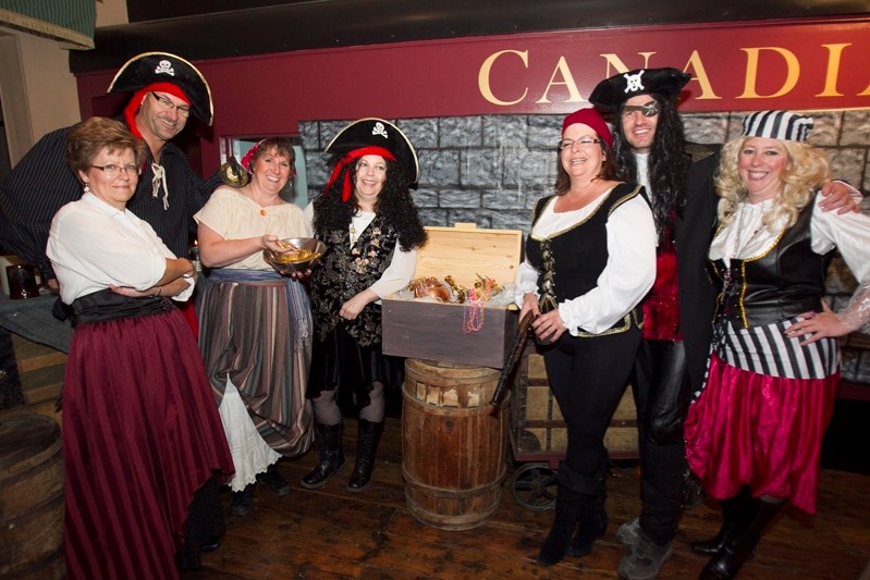 A group of pirates wait for people to put to work during Halloween festivities at the Innisfail Historical Village on Oct. 25.