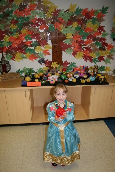 Madison Watson adorned a squash with paint for a Hallowe&#8217;en project at St. Marguerite Bourgeoys Catholic School this fall. She worked on the project at home with her