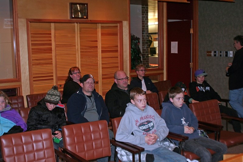 Youth and parents listen intently during the presentation on Nov. 7 at town hall for a new skateboard park.