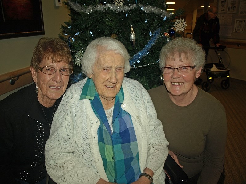 Freda Gillespie (centre) turns 100 years young Dec. 14. On the right is her 71-year-old daughter Vera Johnson and on the left is her first daughter-in-law Marie Moore, who