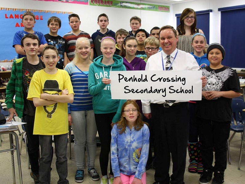 Mark Crawford, vice principal at Penhold School, is with Grade 8 students celebrating the chosen name of the town&#8217;s new school &#8211; Penhold Crossing Secondary School 