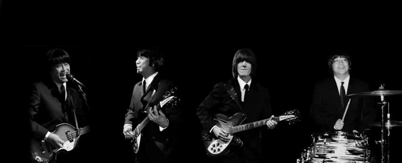Nathan Loo (Paul McCartney), Ven Guerra (John Lennon), Shaun Whitham (George Harrison), and Nick Penaranda (Ringo Starr) perfrom as the Beatles in All You Need is Love.