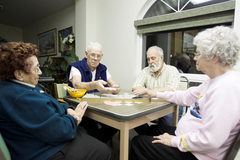 Autumn Glen Lodge residents (left to right) Fran Kehler, Roy Kennedy, Brian Hawking and Jean Bryan play crib on Jan. 23.