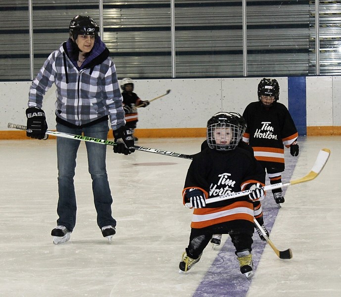 Four-year-old Luc Catudal skates during an Eaglettes practice on Jan. 17 under the watchful eyes of a parent-coach.