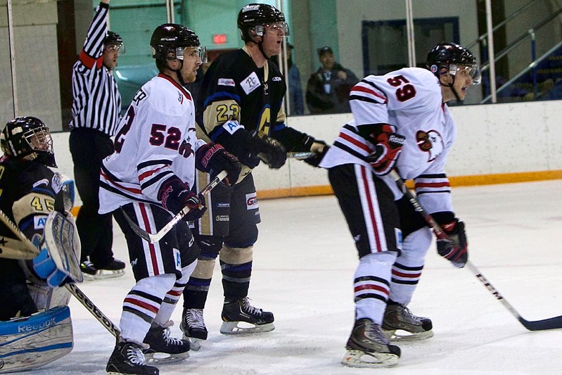 Eagles Chad Ziegler, right, and teammate Cristopher Neurauter buzz around the net of the Bentley Generals on Jan. 24. The Eagles earned a 4-3 come from behind victory at the