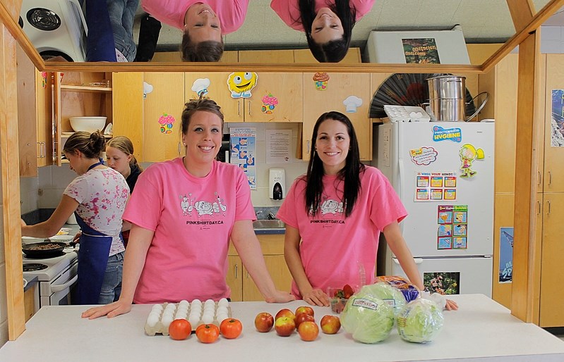 Brianne Fletcher, home economic instructor (left) and Lorraine Dingman, physical education instructor at Innisfail Jr/Sr High, demonstrate elements of a healthy breakfast