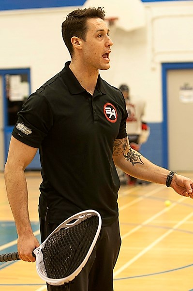 Edmonton Rush goaltender Aaron Bold yells out directions to players performing drills during their training day on March 2.