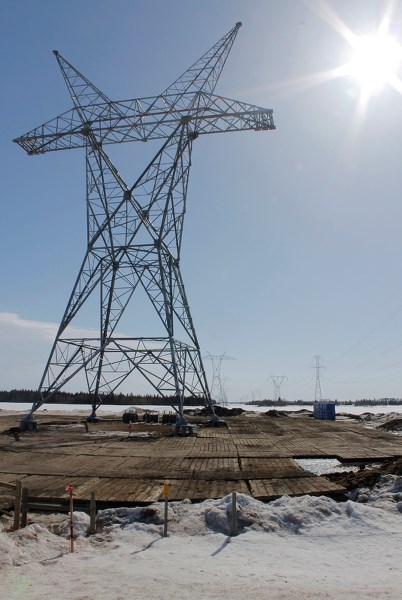 Transmission tower on Cottonwood Road near Rge. Rd. 25 awaits final commisioning on a recent sunny day. AltaLink hearings are taking place in Red Deer to determine the final