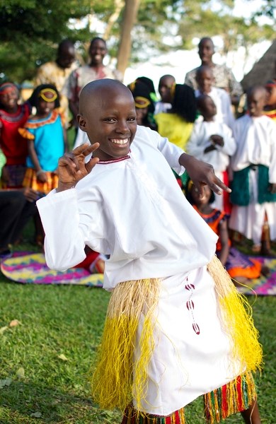 Ronald Mutyabab of the Watoto Children&#8217;s choir performs in front of fellow choirmembers.