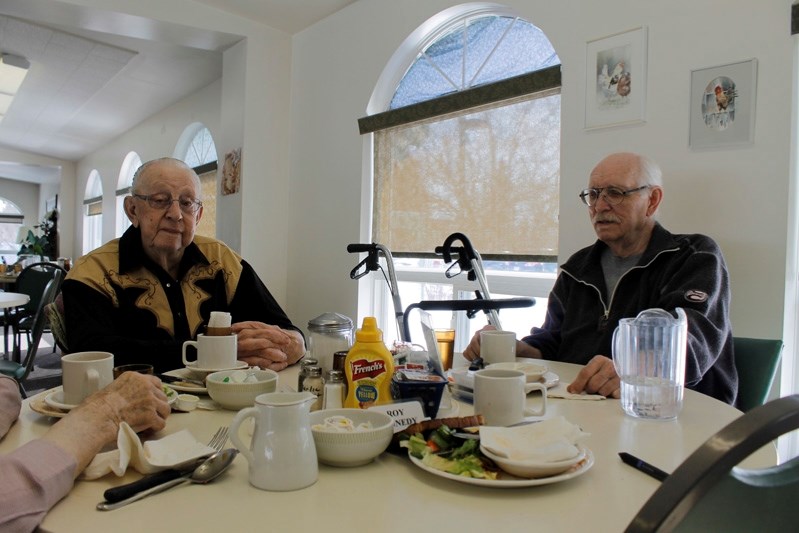 Ron Traudt (left) and Robert Rafferty (Right) relax after lunch at Autumn Glen Lodge.