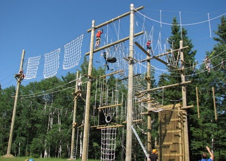 Participants enjoy the high ropes course at NexLevelChallenge course 11 kilometres west of Bowden.