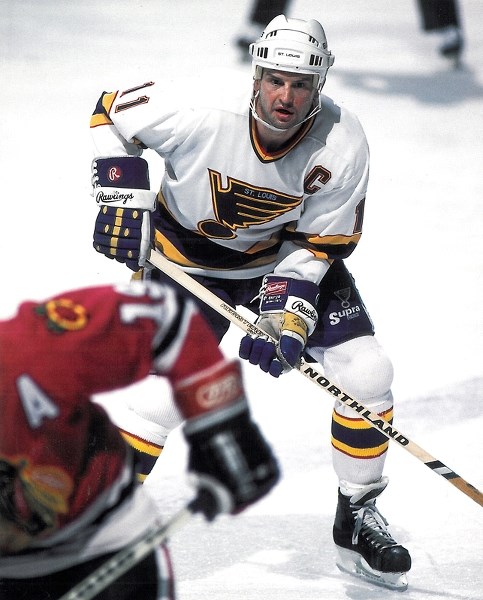 Brian Sutter charges down ice in a St Louis Blues-Chicago Blackhawks game early in his hockey career.
