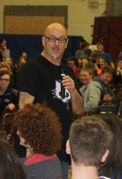 Mitch Dorge, drummer of the Crash Test Dummies interacts with studenta at the Innisfail Middle School gymnasium during his high energy presenation on April 11 in front of 500 