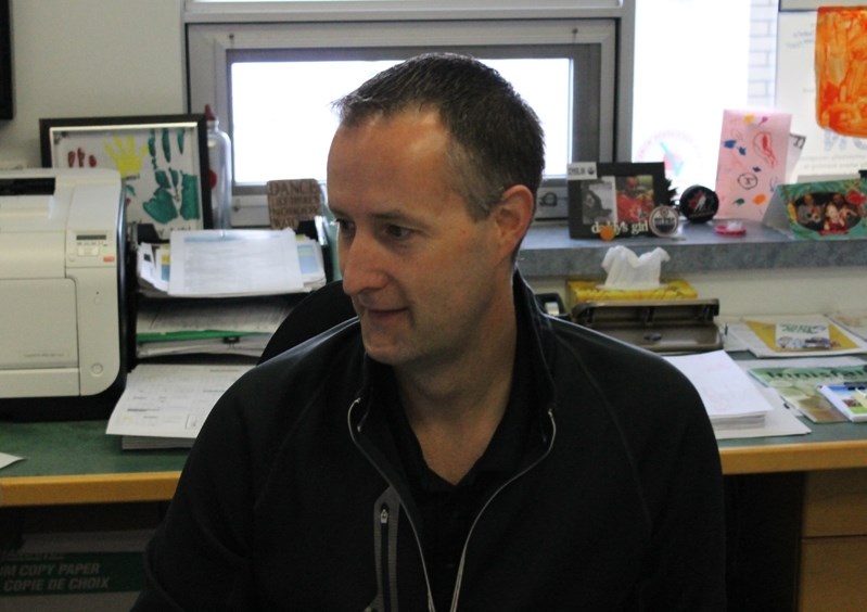 Jeff Anderson, Innisfail Jr/Sr High vice-principal at work in his school office.