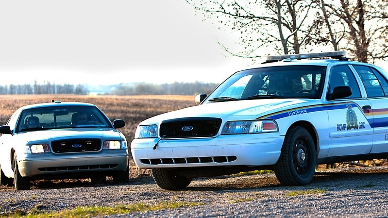 RCMP seal off the murder scene in a field just off Highway 590 where a deceased male was discovered inside a burning F-350 pick-up truck Friday (May 15) afternoon.