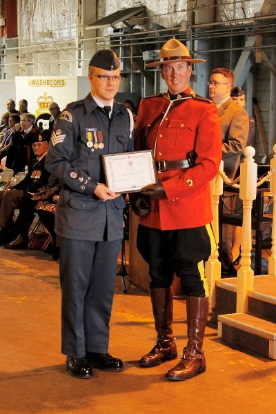 Field Sgt. Jarrod Crashley receives the Lord Strathcona award from Innisfail RCMP Const. Chris Lavery. Crashley also received the Top Senior Cadet and RCAF Top Cadet honours.