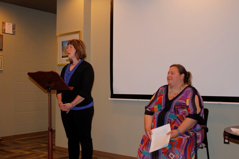 Julie Dallaire speaks on Penhold&#8217;s Community Services Report which was presented on June 23 to town council for information while report author, Jamie Seiyama looks on.