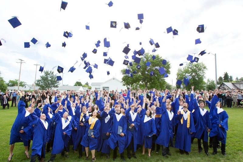 FINAL SALUTE &#8211; The graduating class throw their mortarboards high in the air in celebration after their graduation ceremony at Innisfail Jr./Sr. High school on June 26.