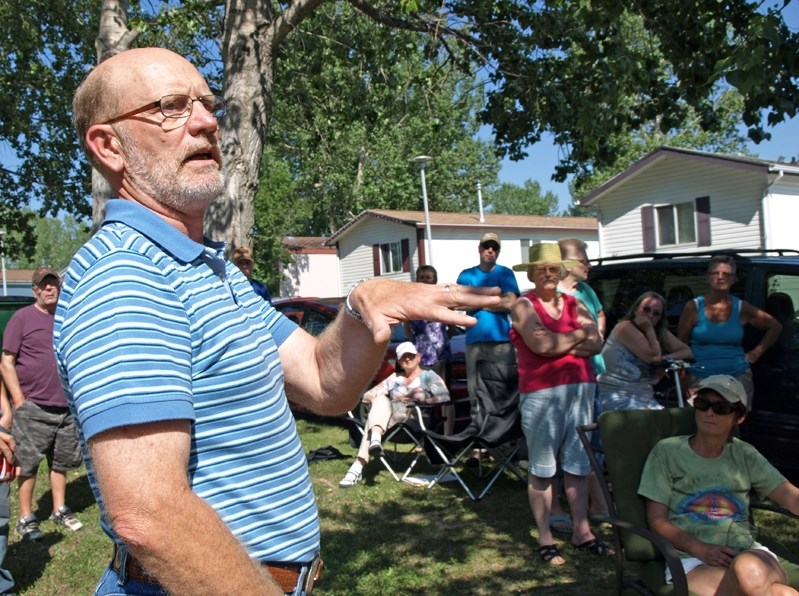 Don Petersen, owner of Westwood Mobile Home Park, spoke to about 40 residents Sunday afternoon (July 13) and urged them to stay united in their battle to fight the